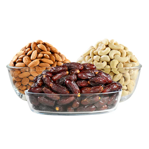 Premium Middle Eastern nuts including almonds, cashews, and dates in clear glass bowls.
